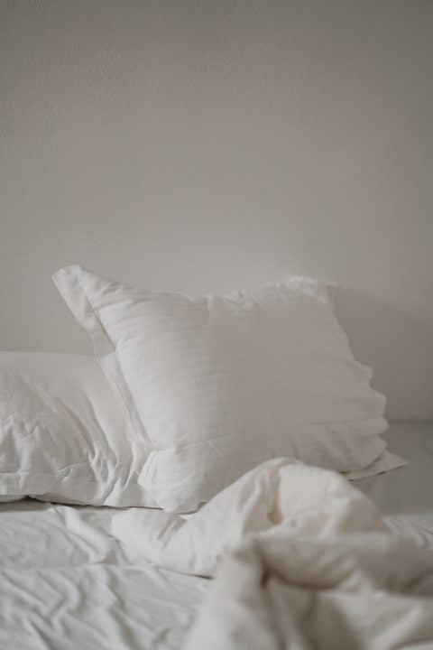bed with white sheets